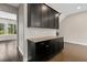 Custom coffee bar with granite countertop and dark wood cabinets at 1954 Summit Trace Circle Northwest, Atlanta, GA 30318