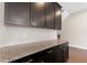 Custom coffee bar with granite countertop and dark wood cabinets at 1954 Summit Trace Circle Northwest, Atlanta, GA 30318
