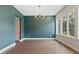Elegant dining room with hardwood floors, a modern light fixture, and large windows at 1954 Summit Trace Circle Northwest, Atlanta, GA 30318