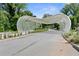 Unique architectural entrance with modern sculpture and landscaping, welcoming you to the community at 1954 Summit Trace Circle Northwest, Atlanta, GA 30318