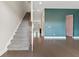 Inviting entryway featuring hardwood floors, a staircase, and stylish wall color accents at 1954 Summit Trace Circle Northwest, Atlanta, GA 30318