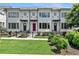 Charming townhouse with white facade, black trim, and well-maintained landscaping enhancing curb appeal at 1954 Summit Trace Circle Northwest, Atlanta, GA 30318