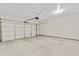 Spacious two car garage with a light-colored concrete floor and modern garage door opener at 1954 Summit Trace Circle Northwest, Atlanta, GA 30318