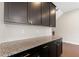 A granite countertop and dark cabinets provide ample counter space and storage at 1954 Summit Trace Circle Northwest, Atlanta, GA 30318