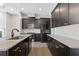 Modern kitchen boasts granite countertops, dark cabinets, and stainless steel appliances at 1954 Summit Trace Circle Northwest, Atlanta, GA 30318