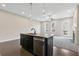 Modern kitchen island features a granite countertop, sink, and stainless steel dishwasher at 1954 Summit Trace Circle Northwest, Atlanta, GA 30318