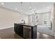 Open kitchen with a central island, stainless steel appliances, and dark wood floors at 1954 Summit Trace Circle Northwest, Atlanta, GA 30318