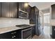 Modern kitchen with stainless steel appliances and dark wood cabinets at 1954 Summit Trace Circle Northwest, Atlanta, GA 30318