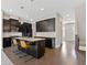 Stylish kitchen with a center island, granite countertops, and black cabinets at 1954 Summit Trace Circle Northwest, Atlanta, GA 30318