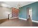 Spacious living area with hardwood floors, modern lighting, and teal accent walls at 1954 Summit Trace Circle Northwest, Atlanta, GA 30318