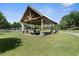 Community pavilion with picnic tables, grassy areas and playground in the background at 1954 Summit Trace Circle Northwest, Atlanta, GA 30318