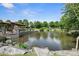 Scenic pond with a stone gazebo, fountain, and lush greenery offering a serene retreat at 1954 Summit Trace Circle Northwest, Atlanta, GA 30318