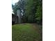 Large backyard featuring a well-maintained lawn and a treelined border for privacy at 101 Royal Way, Mcdonough, GA 30252