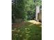 Spacious backyard featuring lawn, perimeter trees and partial fencing for privacy at 101 Royal Way, Mcdonough, GA 30252