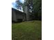 Exterior view of home with a back door, patio and well-maintained lawn at 101 Royal Way, Mcdonough, GA 30252