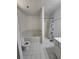 Bathroom with a bathtub and shower, tiled floor, and white fixtures at 101 Royal Way, Mcdonough, GA 30252
