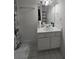 Bright bathroom featuring a vanity with storage and a mirrored medicine cabinet at 101 Royal Way, Mcdonough, GA 30252