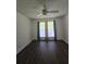 Bright bedroom featuring stylish floors, a ceiling fan, and natural light through the large windows at 101 Royal Way, Mcdonough, GA 30252