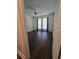 Cozy bedroom showcasing dark floors, soft natural light, and comfortable, welcoming ambiance at 101 Royal Way, Mcdonough, GA 30252