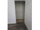 A walk-in closet with carpet and wired shelving; partially obscured by the partially open door at 101 Royal Way, Mcdonough, GA 30252