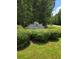 King's Forest community sign surrounded by lush landscaping near a quiet road at 101 Royal Way, Mcdonough, GA 30252