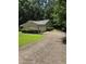 A driveway leads to a one-story home with an attached garage and well-maintained landscaping at 101 Royal Way, Mcdonough, GA 30252