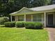 Charming one-story brick home with a covered porch and manicured landscaping at 101 Royal Way, Mcdonough, GA 30252