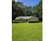 A charming one-story brick home with a manicured lawn and mature trees in the background at 101 Royal Way, Mcdonough, GA 30252