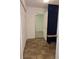 Tile hallway featuring a bench, a decorative door and a closet at 101 Royal Way, Mcdonough, GA 30252