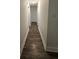 Well-lit hallway with sleek floors, providing a clean and inviting transition between rooms at 101 Royal Way, Mcdonough, GA 30252