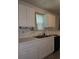 Functional kitchen with ample cabinet space, a window and a convenient layout at 101 Royal Way, Mcdonough, GA 30252