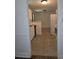 Galley kitchen featuring white cabinets, a tile floor and white appliances at 101 Royal Way, Mcdonough, GA 30252