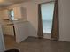 Cozy kitchen with white cabinets, tile floors and a bright window at 101 Royal Way, Mcdonough, GA 30252