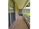 A long, covered porch with brick pillars and white railing runs along the side of this home at 101 Royal Way, Mcdonough, GA 30252