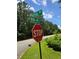 Street sign marking Royal Way and King Mill Road intersection with a stop sign at 101 Royal Way, Mcdonough, GA 30252