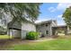 Backyard featuring grass and an elevated back deck with attached covered parking at 232 Whitworth Sw Dr, Atlanta, GA 30331