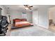 Bedroom featuring neutral paint, a platform bed, and ceiling fan with an en suite bathroom at 232 Whitworth Sw Dr, Atlanta, GA 30331