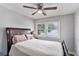 Cozy bedroom features neutral walls, a ceiling fan and ample natural light at 232 Whitworth Sw Dr, Atlanta, GA 30331