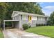 Charming single story home with gray brick and siding, grassy front lawn and updated stairs to the yellow front door at 232 Whitworth Sw Dr, Atlanta, GA 30331