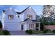 Charming two-story home with white siding, front porch, manicured lawn and attached two-car garage at 2606 Church Nw St, Atlanta, GA 30318
