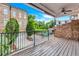 Balcony overlooking the fenced-in in-ground pool and brick buildings at 326 Brownstones Ne Cir, Atlanta, GA 30312