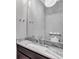 Stylish powder room featuring a marble countertop and modern lighting at 326 Brownstones Ne Cir, Atlanta, GA 30312