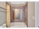 Bathroom with a shower-tub combination featuring decorative tile and modern fixtures at 326 Brownstones Ne Cir, Atlanta, GA 30312