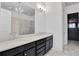 Modern bathroom with double sinks, marble countertops, and a walk-in shower at 326 Brownstones Ne Cir, Atlanta, GA 30312