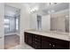 Spacious bathroom featuring double vanities, bright lighting, and marble floors at 326 Brownstones Ne Cir, Atlanta, GA 30312