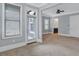 Large bedroom with neutral paint, carpet, and access to a balcony at 326 Brownstones Ne Cir, Atlanta, GA 30312
