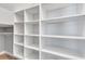 Large walk-in closet with custom built-in shelving, ready for organization at 326 Brownstones Ne Cir, Atlanta, GA 30312