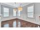 Elegant dining room with hardwood floors, wainscoting, and pendant lighting at 326 Brownstones Ne Cir, Atlanta, GA 30312