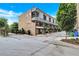 The attractive brick townhome features multiple floors with a gated entrance and attached garage at 326 Brownstones Ne Cir, Atlanta, GA 30312