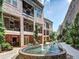 A landscaped walkway with water feature enhances this beautiful brick townhome exterior at 326 Brownstones Ne Cir, Atlanta, GA 30312